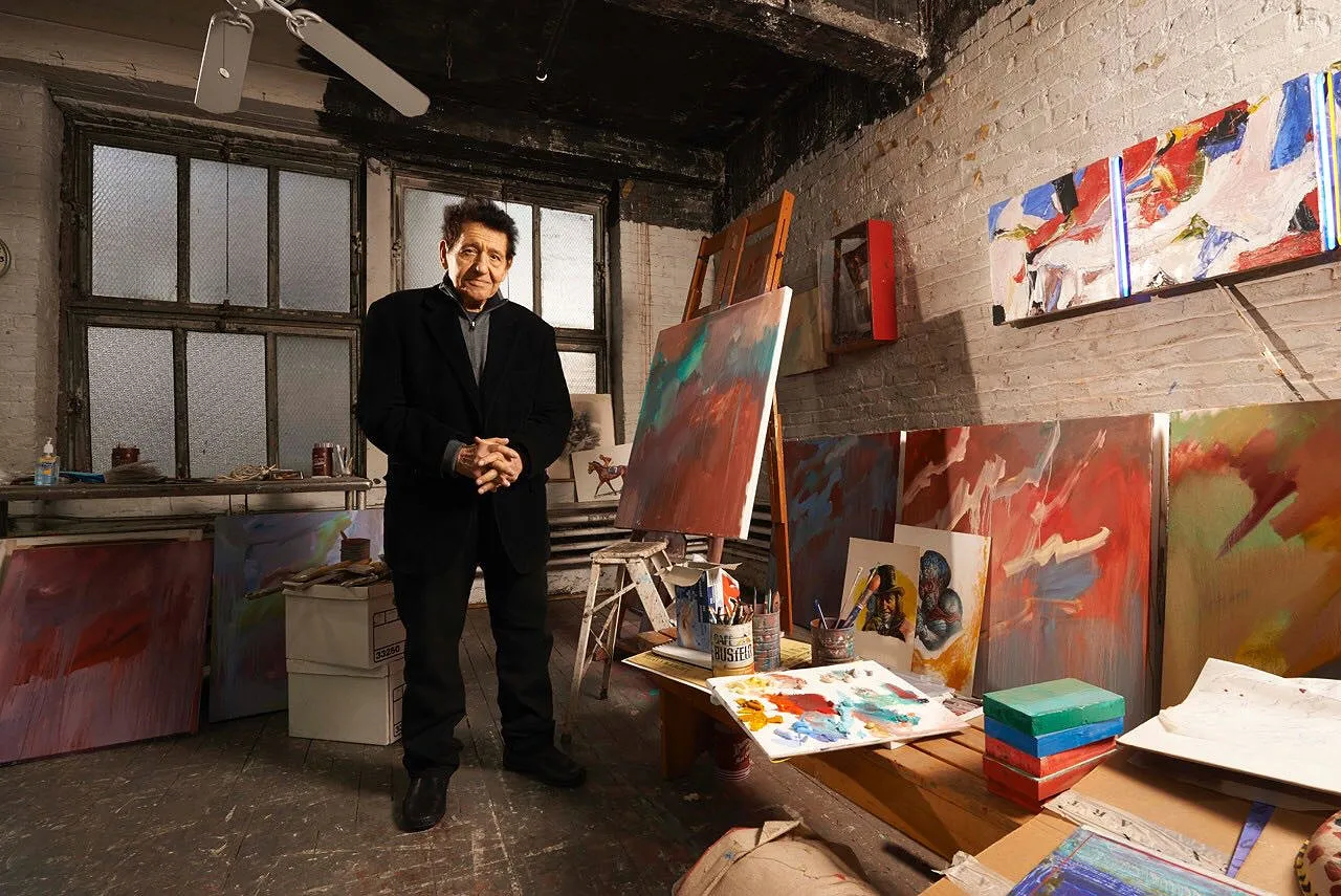 Basil Gogos in his New York studio, surrounded by his paintings.