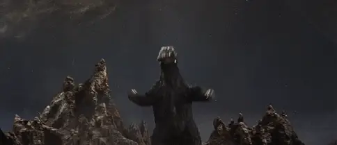 Animated GIF of Godzilla performing his Shē victory dance on the surface of Planet X in Invasion of Astro-Monster (1965).